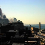032 - 10.35AM - a thick dark plume of smoke, ambulances head down the west side highway